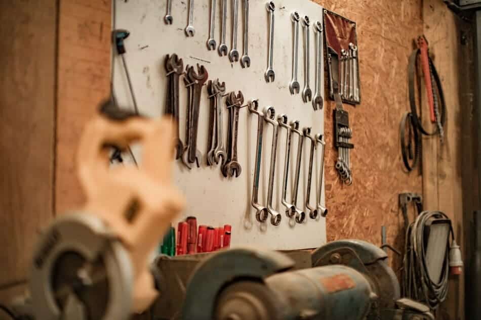 car tools hung on a wooden wall